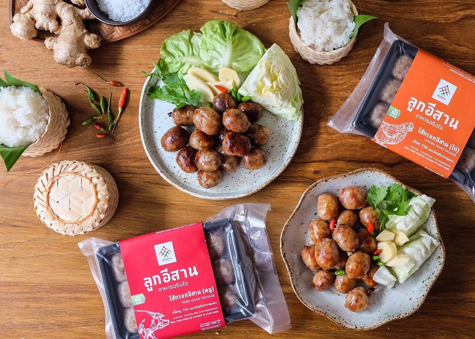 Look Isaan pork and chicken Isaan sausages served with sticky rice and fresh vegetables